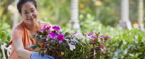 a woman planting flowers